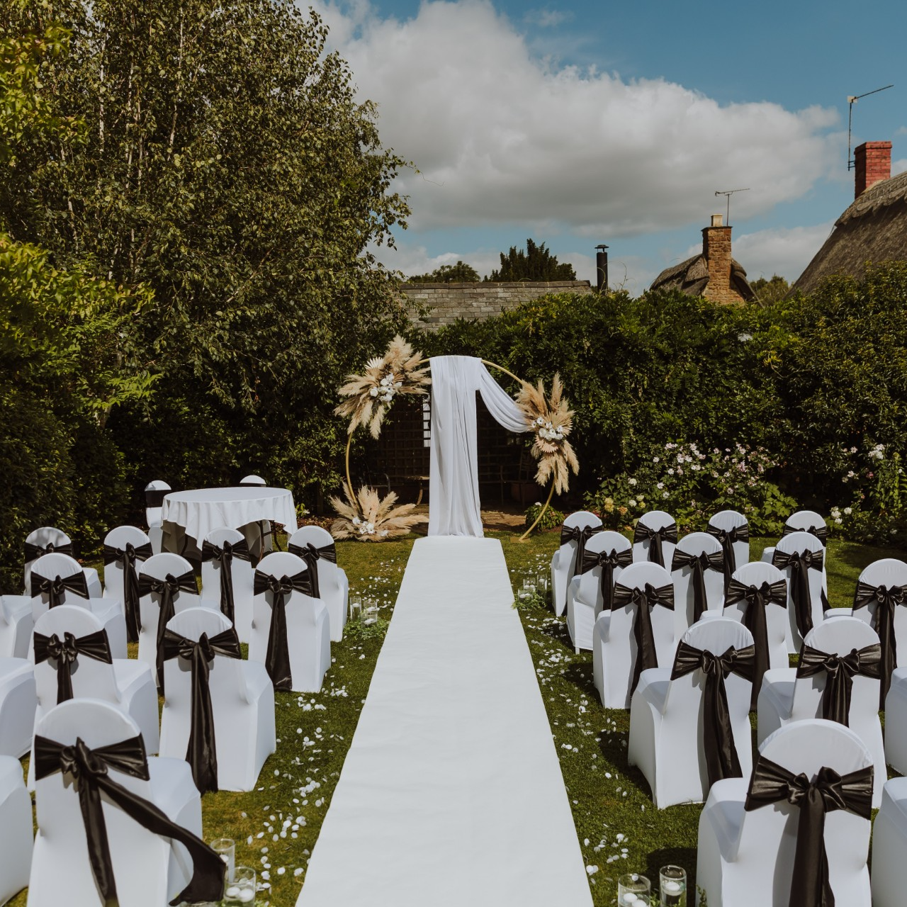 Outdoor wedding ceremony aisle in the Broughton Garden at The Wroxton Hotel